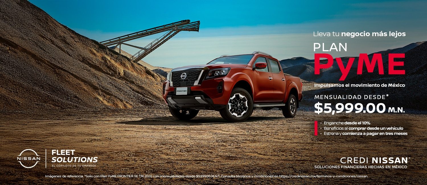 Un trabajador de una empresa de reparto se acerca a dos Nissan Urvan blancas junto al río​